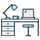 Icon of a desk with a computer and lamp